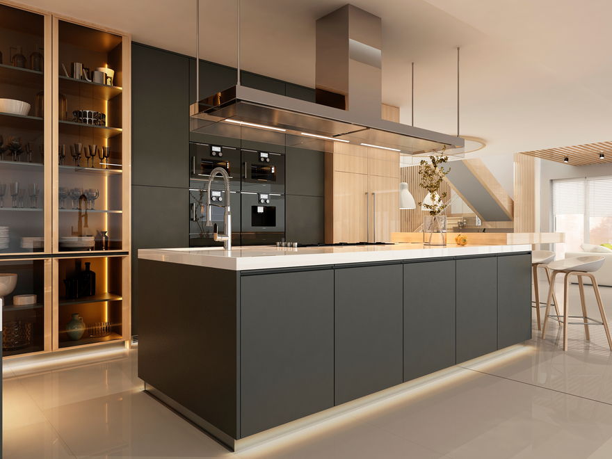 A modern kitchen with a charcoal island lit by LED strip lighting along its base, glass-fronted shelving with built-in lights and a row of wall ovens